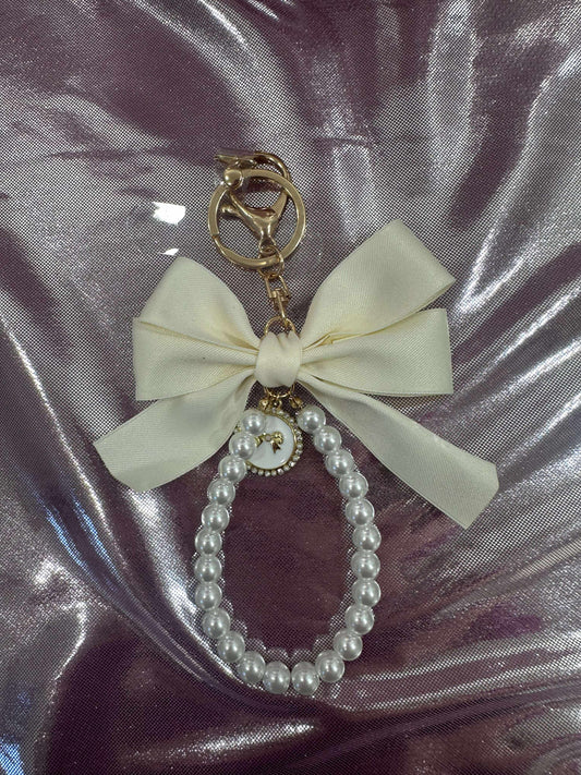 Cream Large Bow Pearl Finger Phone Strap