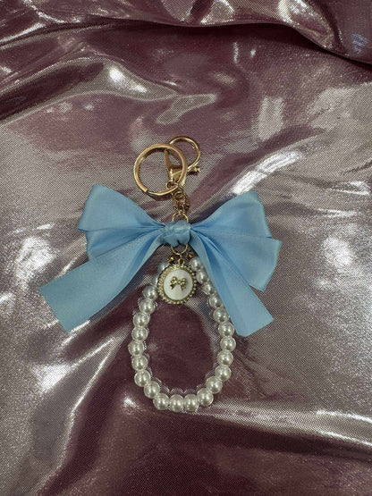 Light Blue Large Bow Pearl Finger Phone Strap