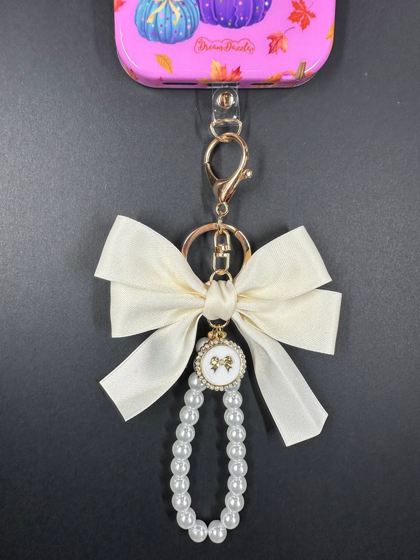 Cream Large Bow Pearl Finger Phone Strap